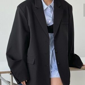 Black oversized blazer with wide sleeve. Woman blazer, suit jacket.